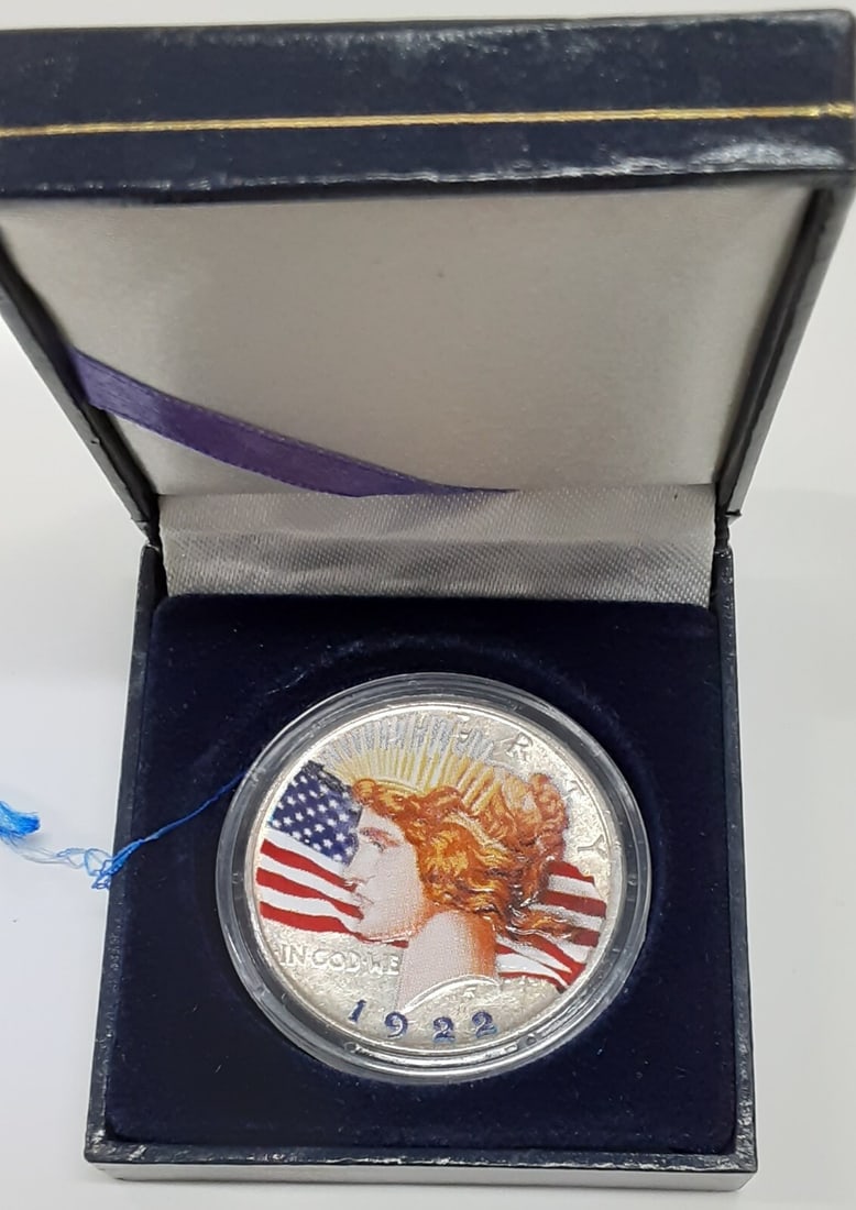 Colorized 1922-D Peace Silver Dollar in Display Capsule: Colorized 1922-D Peace Silver Dollar in Display Capsule This is a 1922-D American Peace Silver Dollar coin featuring a beautiful colorized design on both sides. The coin is uncirculated and comes secu