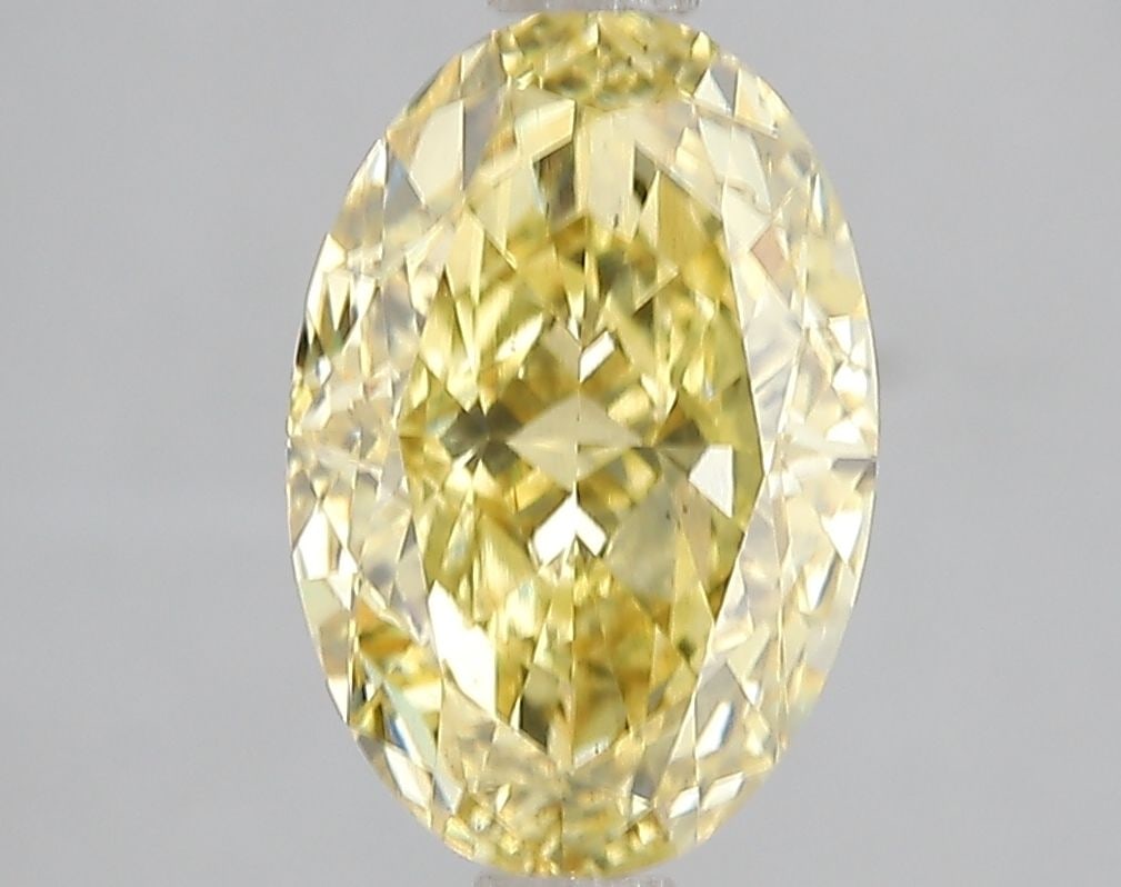 Loose Diamond - OVAL 3.01ct Fancy Vivid Yellow VS2: Loose Diamond - OVAL 3.01ct Fancy Vivid Yellow VS2 Source: This is a real non-mined Diamond that has been grown in a lab Shape: OVAL Carats: 3.01 Color: Fancy Vivid Yellow Certification: IGI Video:
