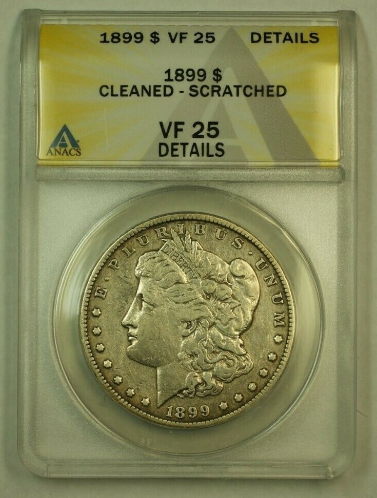 ANACS VF-25 1899 Morgan Dollar Silver Coin Philadelphia Cleaned Scratched: ANACS VF-25 1899 Morgan Dollar Silver Coin Philadelphia Cleaned Scratched This is an 1899 Morgan Silver Dollar from the Philadelphia Mint, certified by ANACS as VF-25 with noted cleaning and scratches