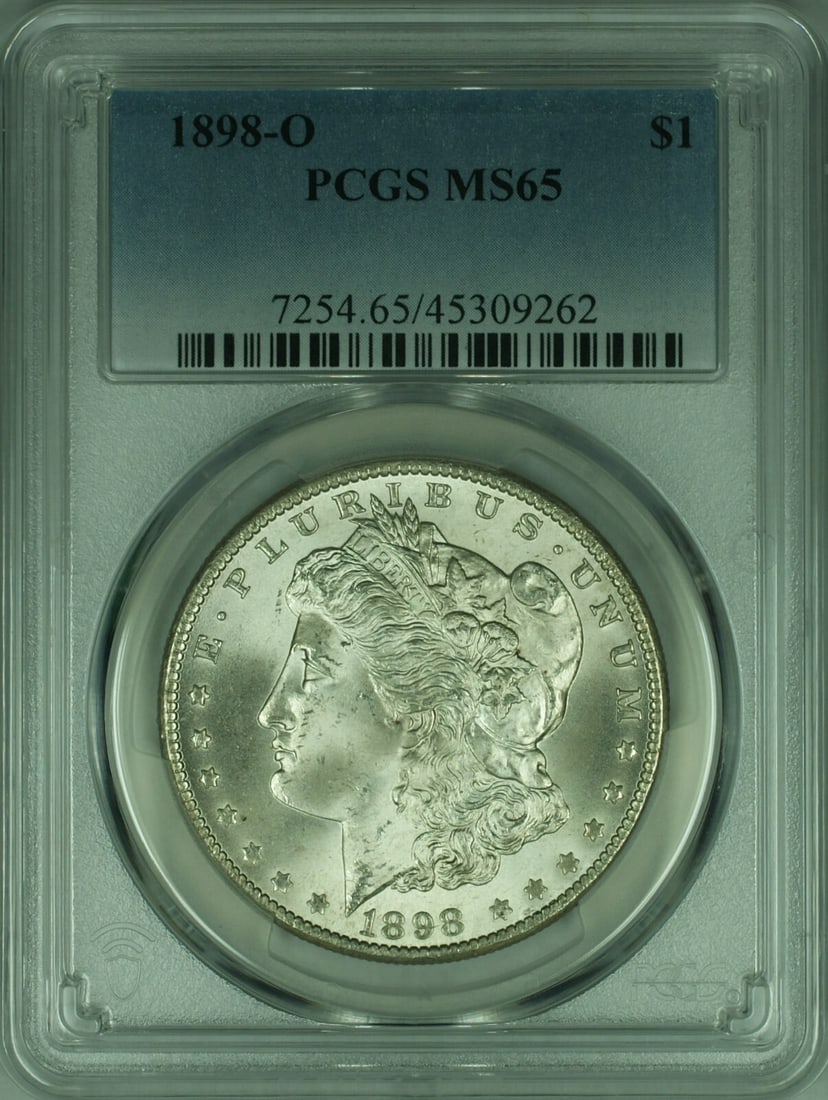 PCGS MS65 1898-O Silver Morgan Dollar Uncirculated New Orleans Mint: PCGS MS65 1898-O Silver Morgan Dollar Uncirculated New Orleans Mint This is an 1898-O Morgan Silver Dollar $1 coin, graded MS-65 by PCGS. Struck at the New Orleans Mint, this uncirculated coin is comp