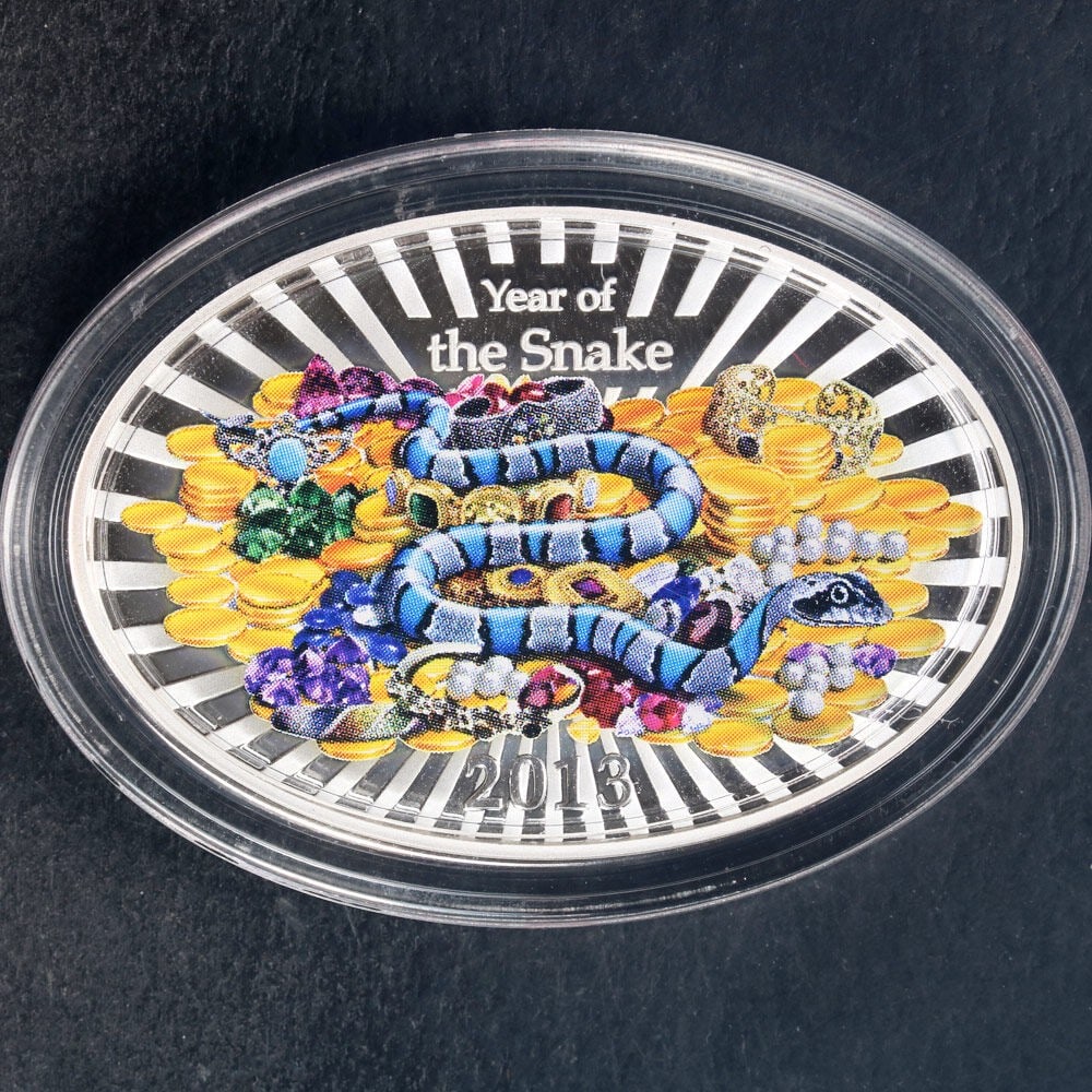 2013 Niue Year of the Snake Colorized 1 Oz Silver Proof Oval Coin OGP: 2013 Niue Year of the Snake Colorized 1 Oz Silver Proof Oval Coin OGP This is a 2013 Niue 1 Ounce Silver $2 coin from the Year of the Snake series. The coin features a colorized oval design and comes