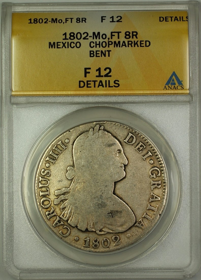 1802 Mexico 8 Reales Silver Coin ANACS F-12 Chopmarked and Bent: 1802 Mexico 8 Reales Silver Coin ANACS F-12 Chopmarked and Bent This 1802-Mo FT Mexico 8 Reales silver coin, graded F-12 Details by ANACS, is a circulated piece from the Colonial period. The coin feat