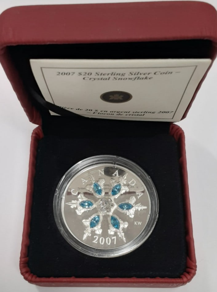 2007 Canadian $20 Proof Silver Coin with Blue Crystal Snowflake RCM Box and COA: 2007 Canadian $20 Proof Silver Coin with Blue Crystal Snowflake RCM Box and COA This 2007 Canada $20 proof commemorative coin features a blue aquamarine crystal snowflake design. Struck in .925 silver