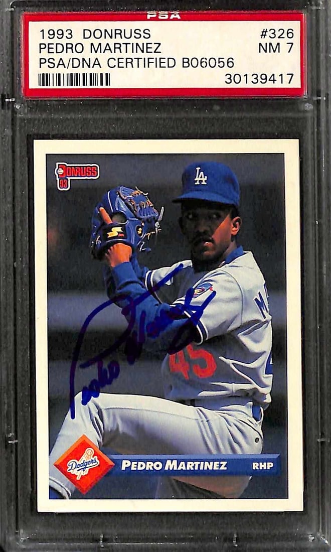 PSA 7 Pedro Martinez Autographed 1991 Donruss Baseball Card With PSA/DNA Auth: PSA 7 Pedro Martinez Autographed 1991 Donruss Baseball Card With PSA/DNA Auth This is an original 1993 Donruss #326 sports trading card signed by Los Angeles Dodgers pitcher Pedro Martinez. The card f