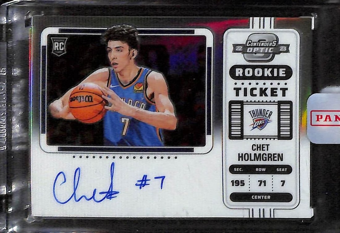 Chet Holmgren 2022-23 Panini Optic Rookie Ticket Auto Card #131 Thunder: Chet Holmgren 2022-23 Panini Optic Rookie Ticket Auto Card #131 Thunder This 2022-23 Contenders Optic Rookie Ticket Card features Chet Holmgren, a promising player for the Oklahoma City Thunder. This