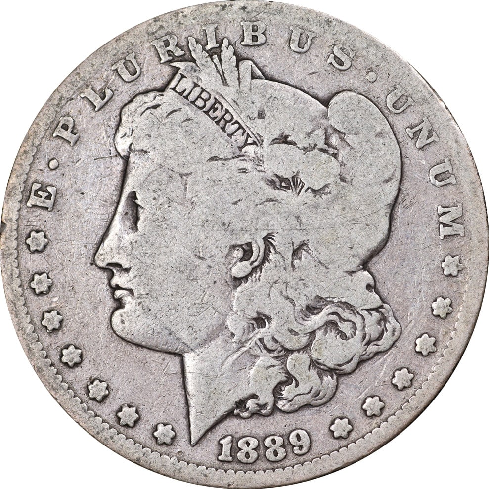 1889-CC Morgan Silver Dollar Key Date Nice G Grade Silver Coin: 1889-CC Morgan Silver Dollar Key Date Nice G Grade Silver Coin This 1889-CC Morgan Silver Dollar showcases a nice grade of Good (G) with appealing eye appeal and a solid strike. Minted in Carson City,