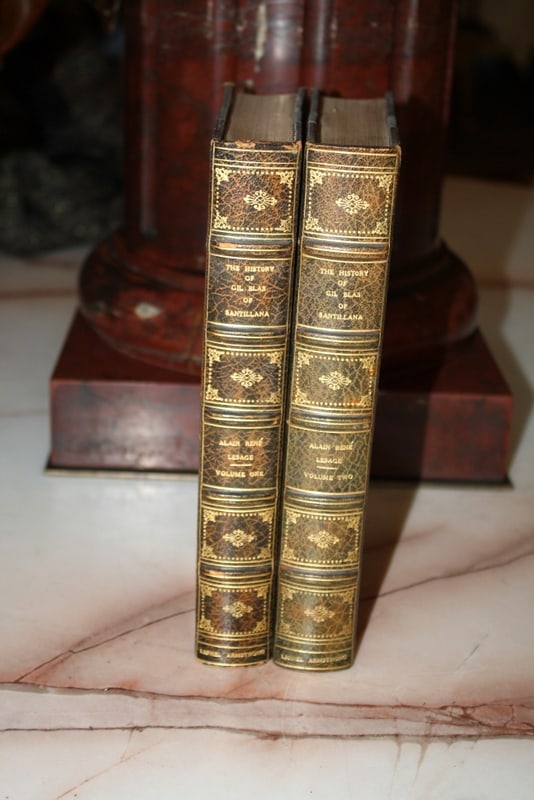 1898 Leather Bound 2 Volume Set History of Gil Blas by Alain Rene Lesage: 1898 Leather Bound 2 Volume Set History of Gil Blas by Alain Rene Lesage Discover a remarkable collection with this original two-volume set of "The History of Gil Blas of Santillana" by Alain Rene Les