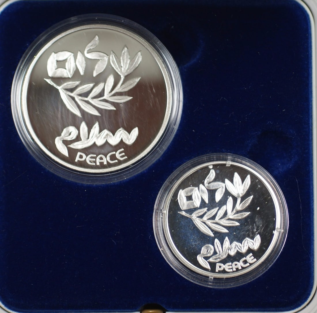 Israel 1995 Peace Treaty Two Silver Coins Proof and Uncirculated Set with Box COA: Israel 1995 Peace Treaty Two Silver Coins Proof and Uncirculated Set with Box COA This 1995 Israel New Sheqalim Peace Treaty set includes two sterling silver coins commemorating the Israel-Jordan Peac