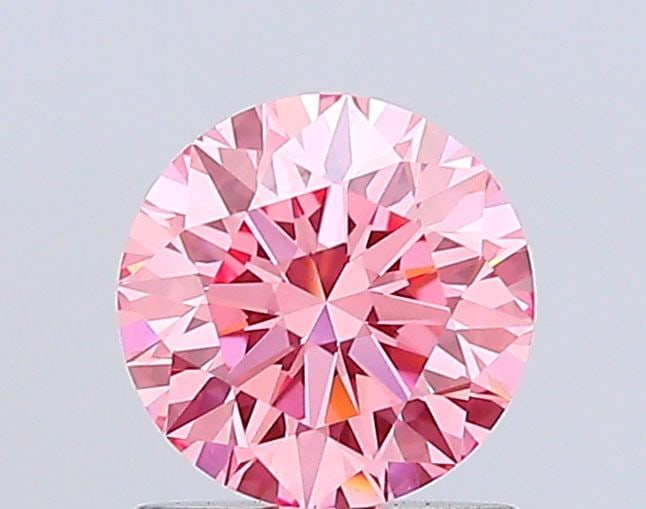 Ideal Loose Diamond - ROUND 1.04ct Fancy Vivid Pink VS1: Ideal Loose Diamond - ROUND 1.04ct Fancy Vivid Pink VS1 Source: This is a real non-mined Diamond that has been grown in a lab Shape: ROUND Carats: 1.04 Color: Fancy Vivid Pink Certification: IGI Video