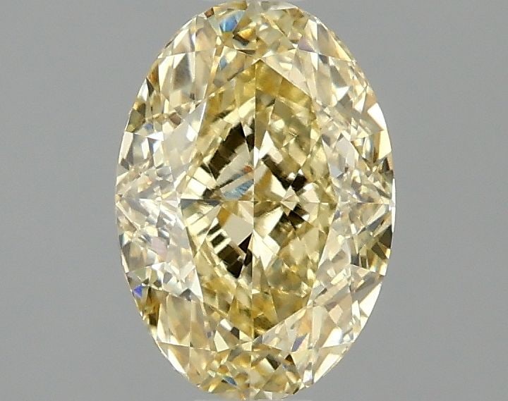 Loose Diamond - OVAL 1.57ct Fancy Vivid Yellow VVS2: Loose Diamond - OVAL 1.57ct Fancy Vivid Yellow VVS2 Source: This is a real non-mined Diamond that has been grown in a lab Shape: OVAL Carats: 1.57 Color: Fancy Vivid Yellow Certification: IGI Video: