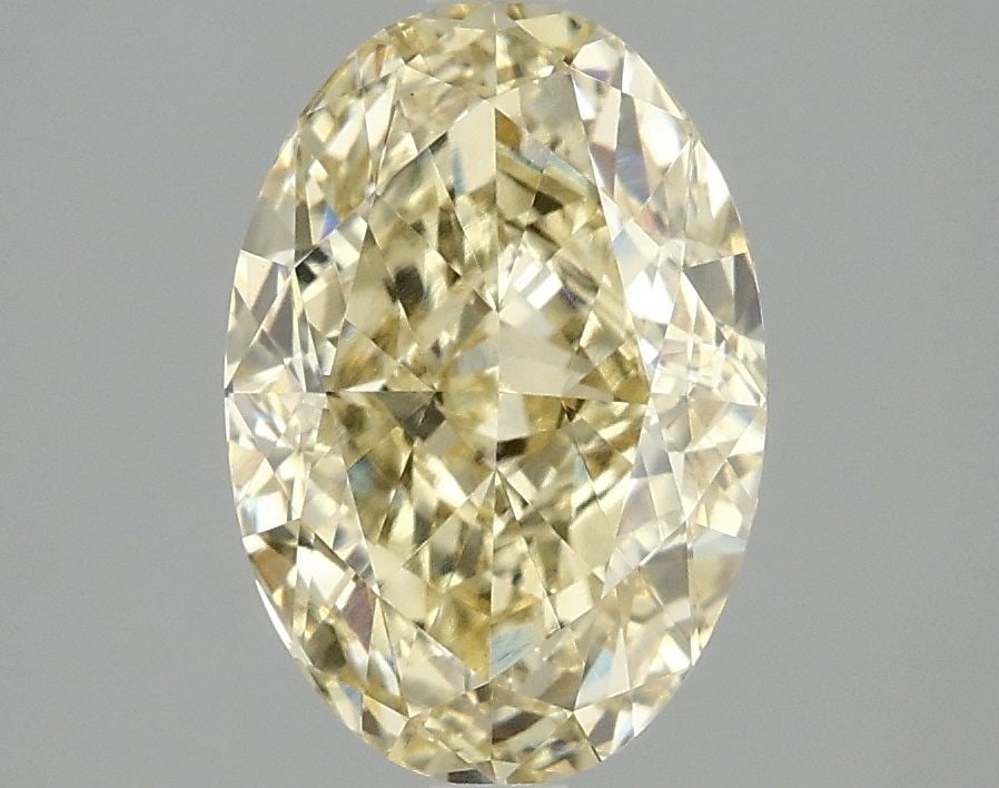 Loose Diamond - OVAL 3.04ct Fancy Vivid Yellow VS1: Loose Diamond - OVAL 3.04ct Fancy Vivid Yellow VS1 Source: This is a real non-mined Diamond that has been grown in a lab Shape: OVAL Carats: 3.04 Color: Fancy Vivid Yellow Certification: IGI Video: