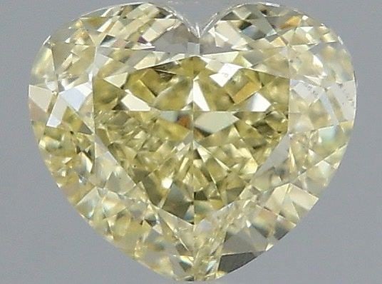 Loose Diamond - HEART 1.05ct Fancy Yellow VS1: Loose Diamond - HEART 1.05ct Fancy Yellow VS1 Source: This is a real non-mined Diamond that has been grown in a lab Shape: HEART Carats: 1.05 Color: Fancy Yellow Certification: IGI Video: