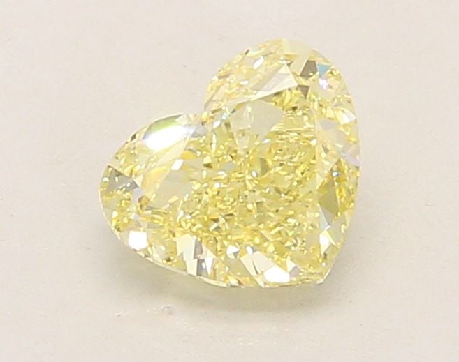 Loose Diamond - HEART 1.03ct Fancy Yellow VS1: Loose Diamond - HEART 1.03ct Fancy Yellow VS1 Source: This is a real non-mined Diamond that has been grown in a lab Shape: HEART Carats: 1.03 Color: Fancy Yellow Certification: IGI Video:
