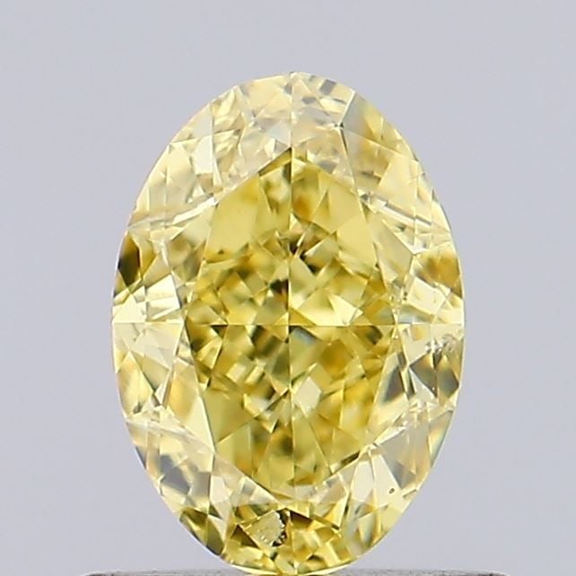 Loose Diamond - OVAL 0.72ct Fancy Vivid Yellow SI1: Loose Diamond - OVAL 0.72ct Fancy Vivid Yellow SI1 Source: This is a real non-mined Diamond that has been grown in a lab Shape: OVAL Carats: 0.72 Color: Fancy Vivid Yellow Certification: IGI Video: