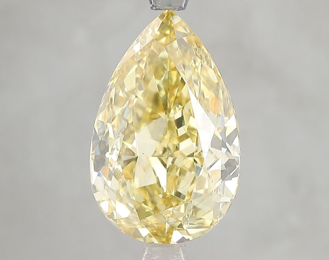 Loose Diamond - PEAR 5.19ct Fancy Vivid Yellow VS1: Loose Diamond - PEAR 5.19ct Fancy Vivid Yellow VS1 Source: This is a real non-mined Diamond that has been grown in a lab Shape: PEAR Carats: 5.19 Color: Fancy Vivid Yellow Certification: IGI Video: