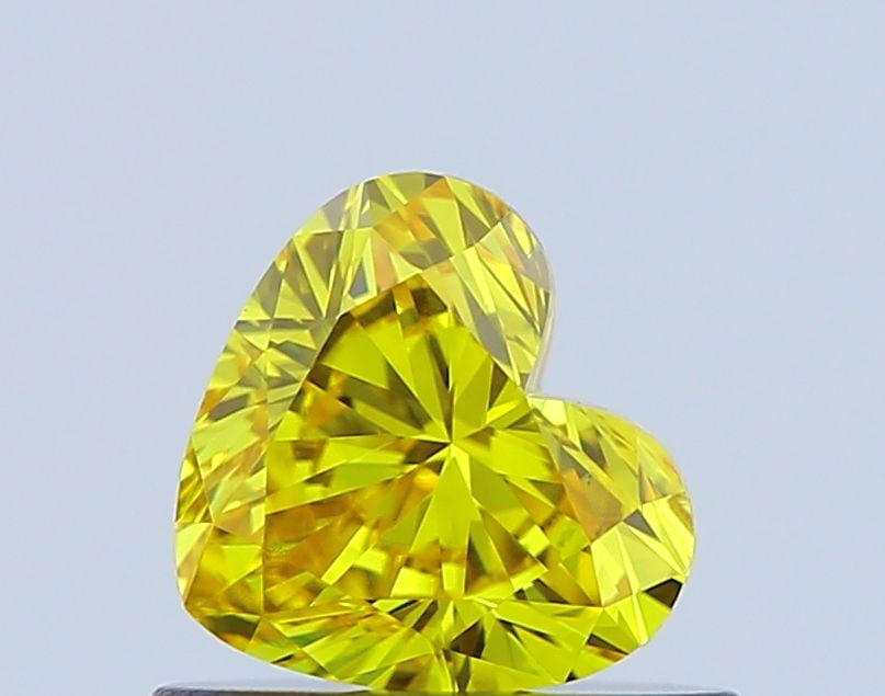 Loose Diamond - HEART 0.52ct Fancy Vivid Yellow VS1: Loose Diamond - HEART 0.52ct Fancy Vivid Yellow VS1 Source: This is a real non-mined Diamond that has been grown in a lab Shape: HEART Carats: 0.52 Color: Fancy Vivid Yellow Certification: IGI Video: