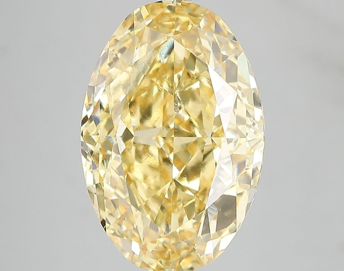 Loose Diamond - OVAL 7.05ct Fancy Vivid Yellow VS1: Loose Diamond - OVAL 7.05ct Fancy Vivid Yellow VS1 Source: This is a real non-mined Diamond that has been grown in a lab Shape: OVAL Carats: 7.05 Color: Fancy Vivid Yellow Certification: IGI Video: