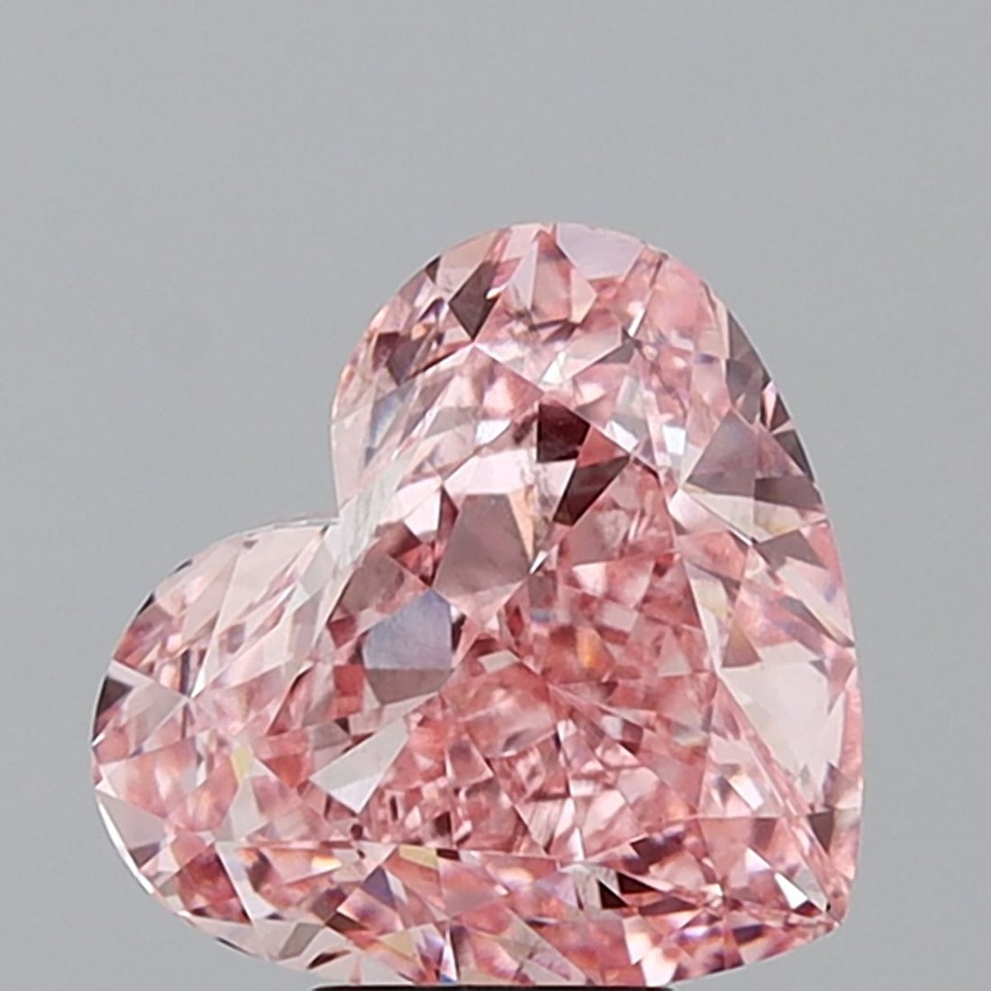 Loose Diamond - HEART 7.06ct Fancy Vivid Pink VS2: Loose Diamond - HEART 7.06ct Fancy Vivid Pink VS2 Source: This is a real non-mined Diamond that has been grown in a lab Shape: HEART Carats: 7.06 Color: Fancy Vivid Pink Certification: IGI Video: