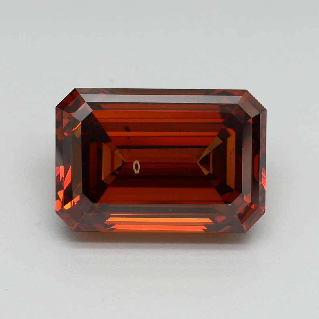 Loose Diamond - EMERALD 7.11ct Fancy Deep Orange VS2: Loose Diamond - EMERALD 7.11ct Fancy Deep Orange VS2 Source: This is a real non-mined Diamond that has been grown in a lab Shape: EMERALD Carats: 7.11 Color: Fancy Deep Orange Certification: IGI Video