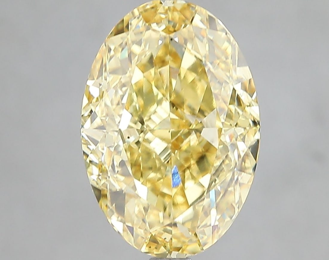 Loose Diamond - OVAL 5.04ct Fancy Vivid Yellow VS2: Loose Diamond - OVAL 5.04ct Fancy Vivid Yellow VS2 Source: This is a real non-mined Diamond that has been grown in a lab Shape: OVAL Carats: 5.04 Color: Fancy Vivid Yellow Certification: IGI Video: