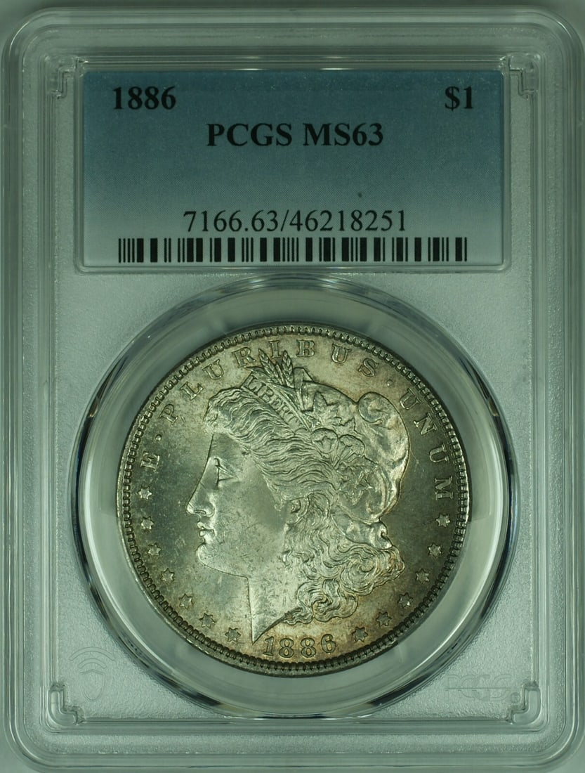 PCGS MS-63 1886 Morgan Dollar Silver Coin With Attractive Toning: PCGS MS-63 1886 Morgan Dollar Silver Coin With Attractive Toning This is an 1886 Morgan Silver Dollar coin certified by PCGS with a grade of MS-63. It features attractive toning and was minted in Phil