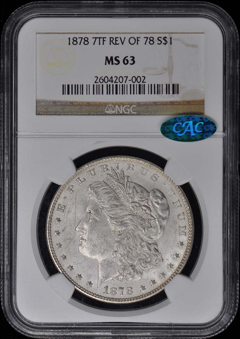 1878 Morgan Dollar 7 Tail Feathers Reverse of 78 NGC MS63 CAC Certified: 1878 Morgan Dollar 7 Tail Feathers Reverse of 78 NGC MS63 CAC Certified This is an un-used 1878 Morgan Silver Dollar featuring the 7 Tail Feathers Reverse of '78, graded MS63 by NGC and certified by C