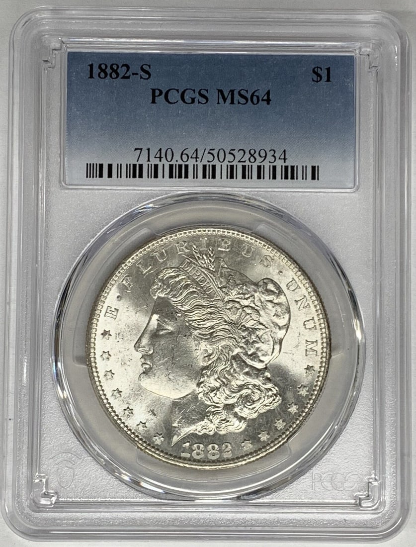 PCGS MS 64 1882-S Morgan Silver Dollar Uncirculated US Coin: PCGS MS 64 1882-S Morgan Silver Dollar Uncirculated US Coin This is an 1882-S Morgan Silver Dollar graded MS 64 by PCGS. The coin is uncirculated and composed of silver, originating from the United St