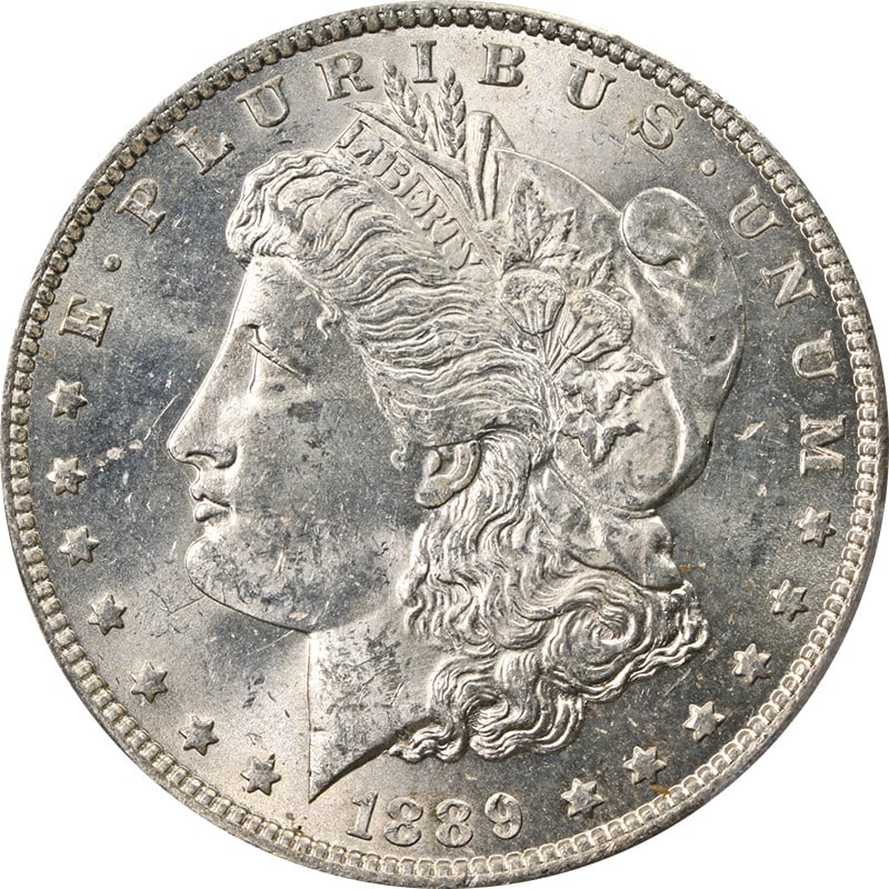 PCGS MS62 Plus 1889-O Silver Dollar New Orleans Mint Uncirculated: PCGS MS62 Plus 1889-O Silver Dollar New Orleans Mint Uncirculated This 1889-O Morgan Silver Dollar is graded MS62+ by PCGS and features excellent eye appeal with a strong strike and vibrant luster. Th