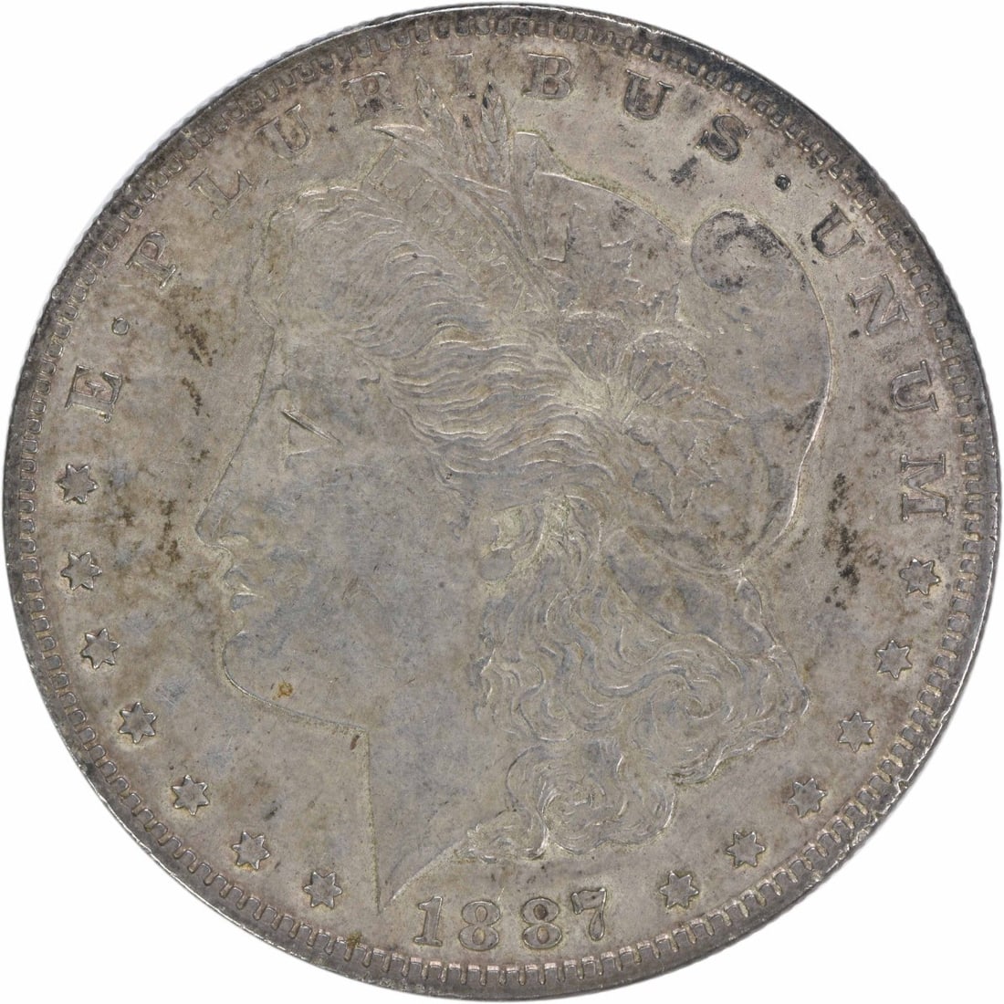 1887 Texas Morgan Silver Dollar AU Uncertified 90% Silver: 1887 Texas Morgan Silver Dollar AU Uncertified 90% Silver This 1887 "Texas" Morgan Silver Dollar is a stunning piece of American numismatic history, featuring a design by George T. Morgan. The coin is