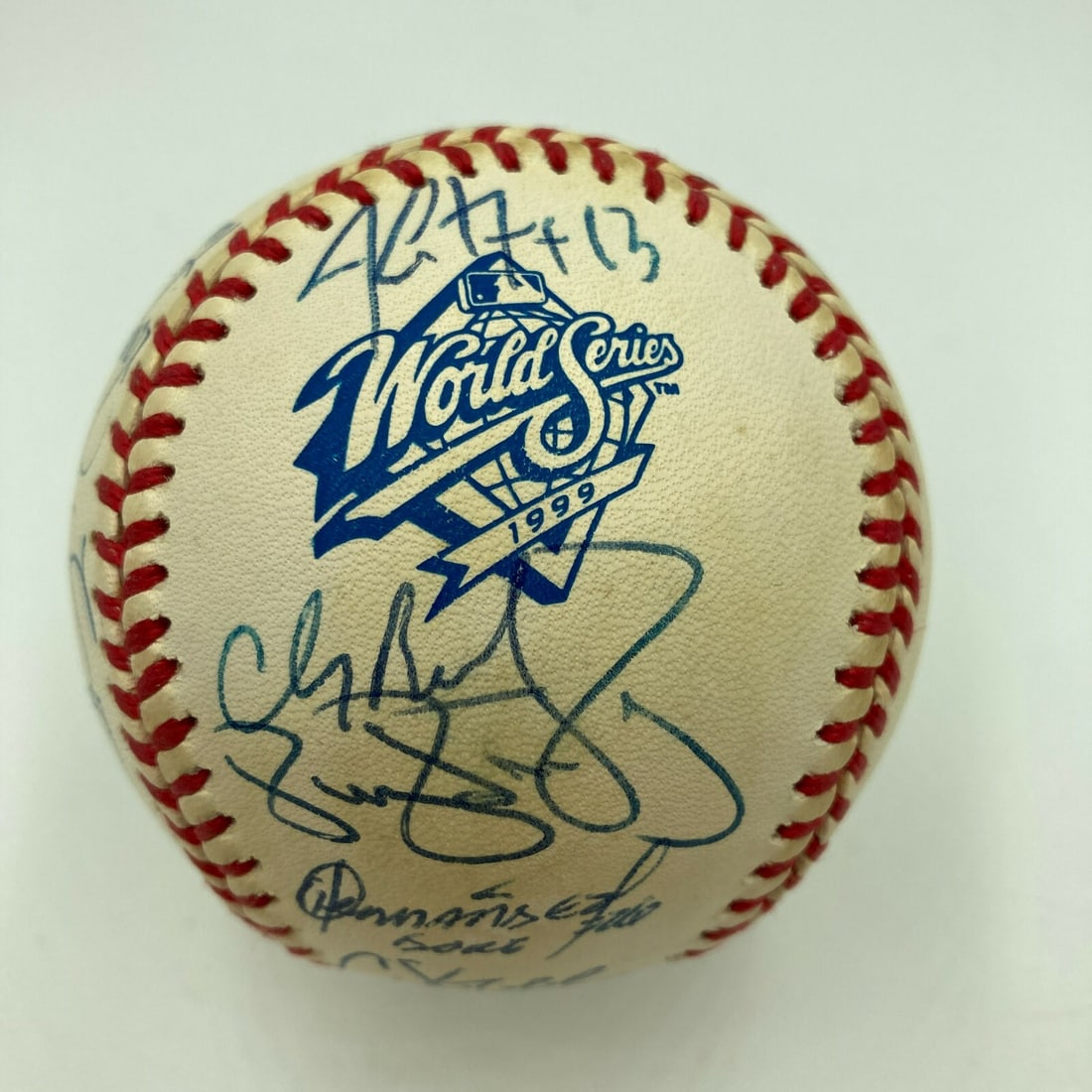 1999 Yankees Team Signed Baseball with Derek Jeter PSA Authentication: 1999 Yankees Team Signed Baseball with Derek Jeter PSA Authentication Celebrate the 1999 New York Yankees' World Series victory with this authentic team-signed baseball. This collectible features sign