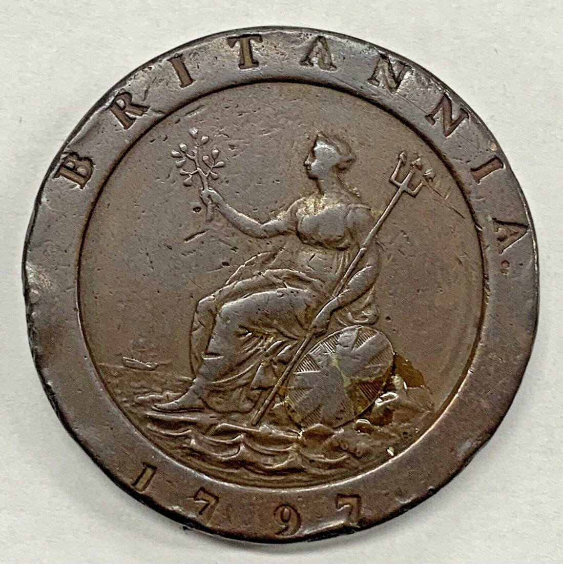 1797 United Kingdom Copper 2 Pence Cartwheel Coin: 1797 United Kingdom Copper 2 Pence Cartwheel Coin This is a 1797 Great Britain 2 Penny Cartwheel coin, composed of copper and originating from the United Kingdom. The coin is circulated and pre-owned,