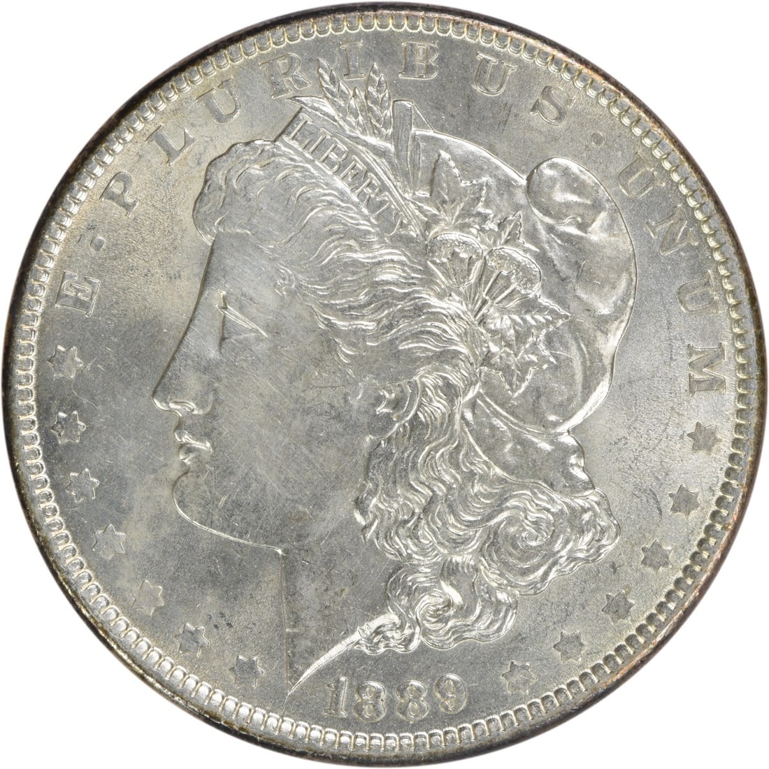 1889 Morgan Silver Dollar BU Uncertified Silver Coin: 1889 Morgan Silver Dollar BU Uncertified Silver Coin This 1889 Morgan Silver Dollar is a beautiful Uncirculated piece, showcasing the iconic design of the Morgan series. Crafted from silver, this coin