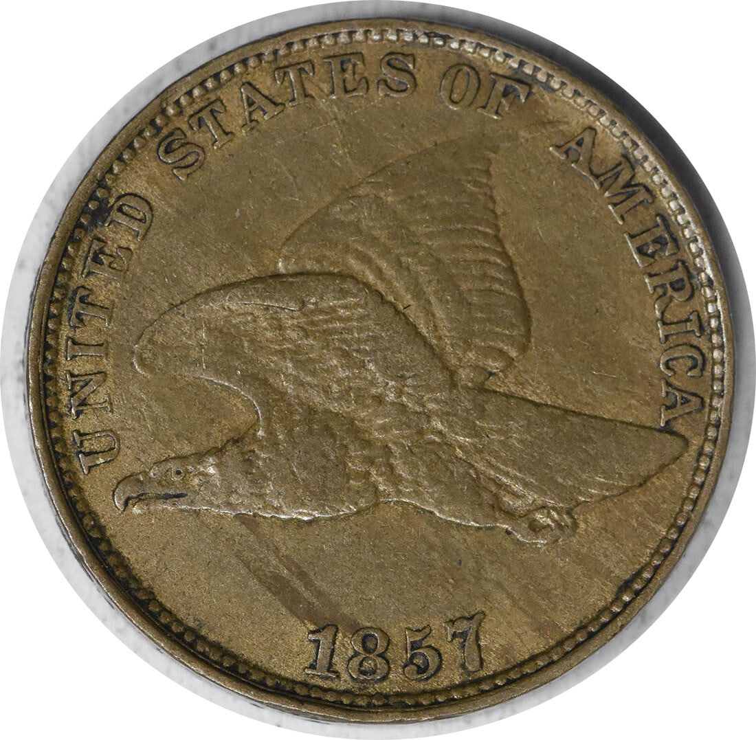 1857 Flying Eagle Cent XF Uncertified Copper Nickel Coin: 1857 Flying Eagle Cent XF Uncertified Copper Nickel Coin This 1857 Flying Eagle Cent is a remarkable collectible coin with a rich history. Struck in Philadelphia, this small cent features the iconic d