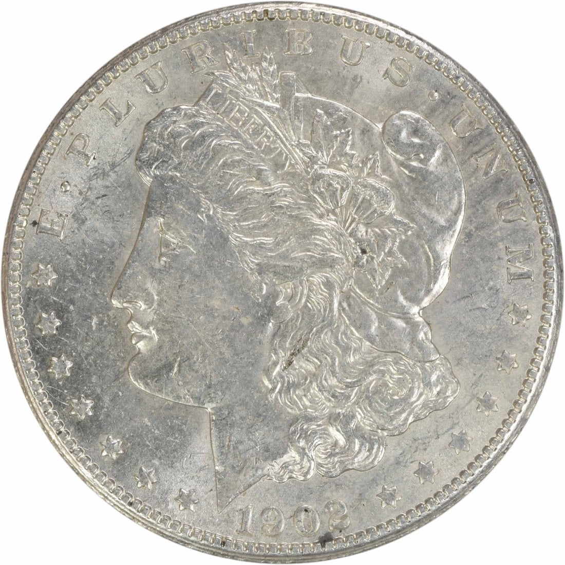 1902 Morgan Silver Dollar AU Uncertified 90% Silver Coin: 1902 Morgan Silver Dollar AU Uncertified 90% Silver Coin This 1902 Morgan Silver Dollar is a beautiful representation of U.S. coinage, showcasing the artistry of designer George T. Morgan. With its AU