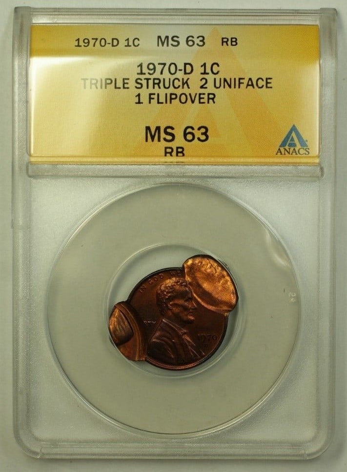 Triple Struck 1970-D Lincoln Memorial Cent Error ANACS MS-63 RB: Triple Struck 1970-D Lincoln Memorial Cent Error ANACS MS-63 RB This is a 1970-D Lincoln Memorial Penny featuring a rare error: triple struck, with two uniface strikes and one flipover. The coin is gr