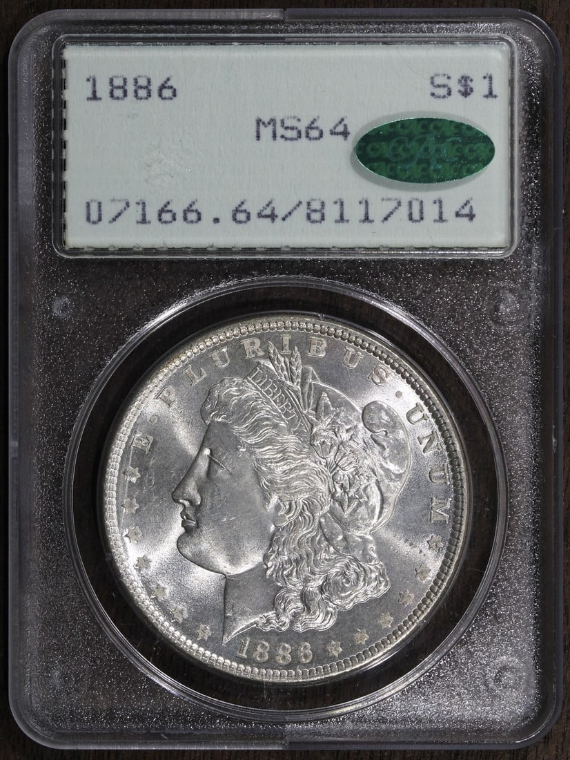 PCGS MS64 CAC Morgan Dollar 1886 Silver $1 Rattler Holder: PCGS MS64 CAC Morgan Dollar 1886 Silver $1 Rattler Holder This 1886 Morgan Silver Dollar is graded MS64 by PCGS and features a CAC sticker, indicating its quality. Struck at the Philadelphia Mint, the