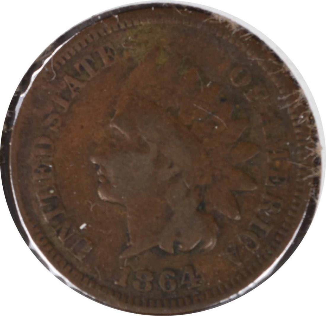 1864 Indian Head Cent Large Reverse Cud Copper Uncertified: 1864 Indian Head Cent Large Reverse Cud Copper Uncertified This 1864 Indian Cent features the unique "L on Ribbon" design and is characterized by a large reverse cud. The coin is in VG (Very Good) con