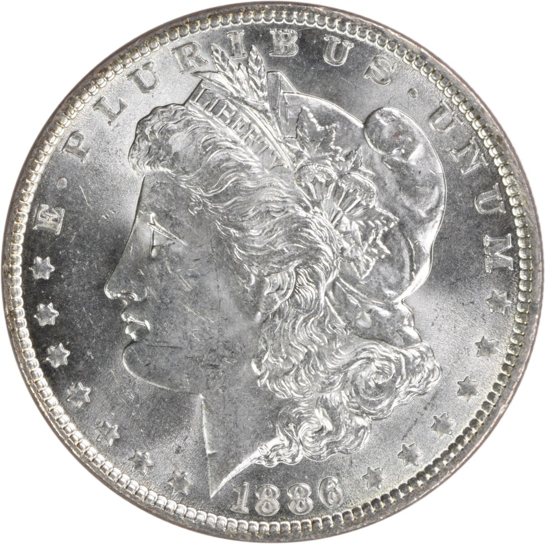 1886 Morgan Silver Dollar Choice BU Uncertified Silver Coin: 1886 Morgan Silver Dollar Choice BU Uncertified Silver Coin This 1886 Morgan Silver Dollar is a beautiful example of the iconic coin, featuring a stunning Choice Brilliant Uncirculated (BU) finish. St