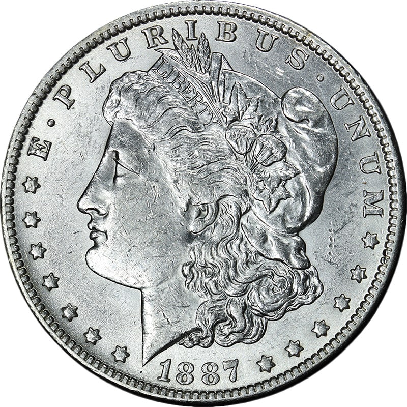 Uncirculated 1887 Over 6 O Mint Morgan Silver Dollar with Strong Luster: Uncirculated 1887 Over 6 O Mint Morgan Silver Dollar with Strong Luster This 1887/6-O Morgan Silver Dollar is an uncirculated coin featuring attractive eye appeal, bright luster, and an average strike