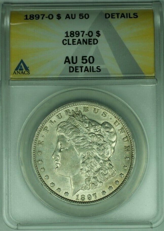 ANACS AU-50 1897-O Morgan Dollar Silver Coin Cleaned New Orleans Mint: ANACS AU-50 1897-O Morgan Dollar Silver Coin Cleaned New Orleans Mint This 1897-O Morgan Silver Dollar is certified by ANACS with an AU-50 Details grade and has been noted as cleaned. Struck at the Ne