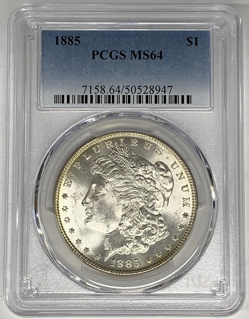 PCGS Certified 1885 Morgan Dollar Silver Coin MS 64 Grade: PCGS Certified 1885 Morgan Dollar Silver Coin MS 64 Grade This is an 1885 Morgan Silver Dollar graded MS 64 by PCGS. The coin originates from the United States, is uncirculated, and is composed of sil