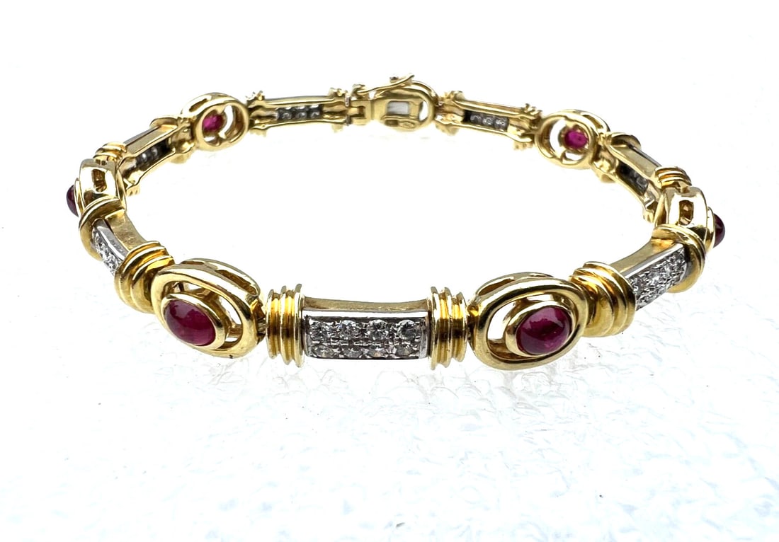 Italian 18K Yellow White Gold Ruby Diamond Bracelet Signed: Italian 18K Yellow White Gold Ruby Diamond Bracelet Signed This exquisite Italian bracelet showcases a stunning combination of 18K yellow and white gold, adorned with vibrant ruby and diamond accents.