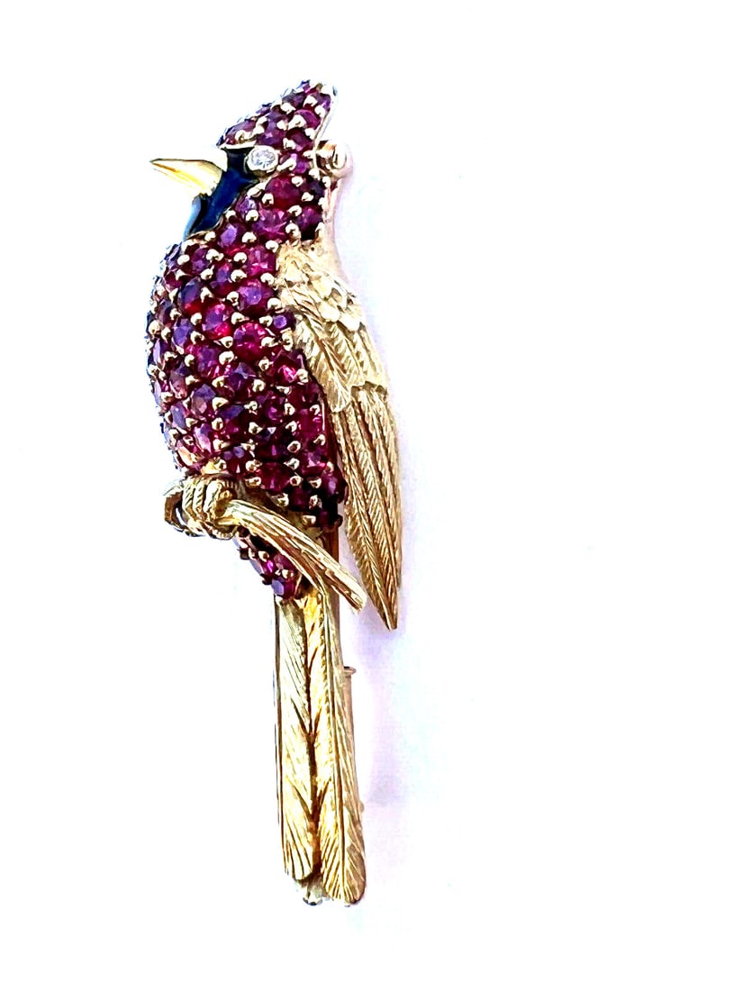 French 18K Yellow Gold Cardinal Bird Brooch with Ruby Diamond Onyx: French 18K Yellow Gold Cardinal Bird Brooch with Ruby Diamond Onyx This exquisite French brooch showcases a cardinal bird crafted in 18k yellow gold, adorned with stunning ruby, diamond, and onyx ston