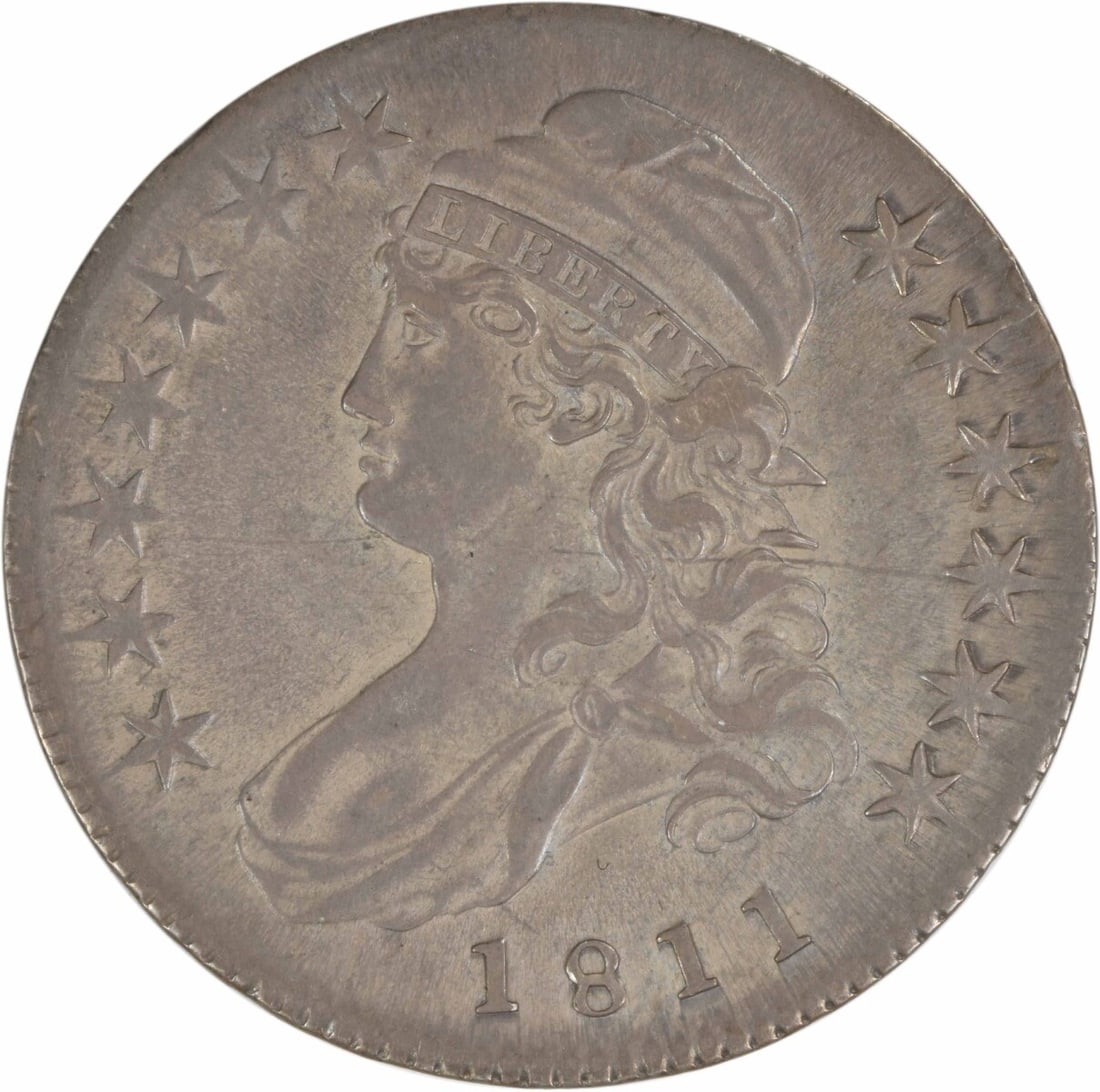 1811 Bust Half Dollar 50C by John Reich Uncertified Silver Coin: 1811 Bust Half Dollar 50C by John Reich Uncertified Silver Coin This 1811 Bust Half Dollar is a remarkable piece of American numismatic history, showcasing the artistry of designer John Reich. The coi