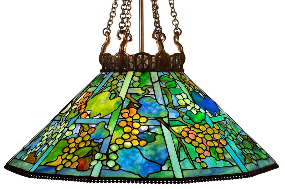 Tiffany Studios Grape Trellis Chandelier Antique Bronze 1900-1919: Tiffany Studios Grape Trellis Chandelier Antique Bronze 1900-1919 This exquisite original Tiffany Studios chandelier features the iconic "Grape Trellis" design crafted with richly colored leaded glass