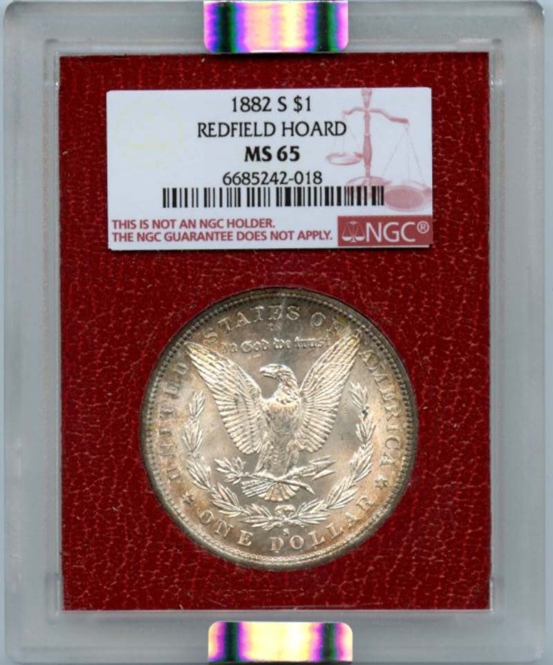 1882 S Morgan Silver Dollar NGC MS65 Redfield Hoard: 1882 S Morgan Silver Dollar NGC MS65 Redfield Hoard This 1882 S Morgan Silver Dollar is a stunning addition to any coin collection. Graded as MS65 by NGC, this uncirculated coin showcases the exceptio