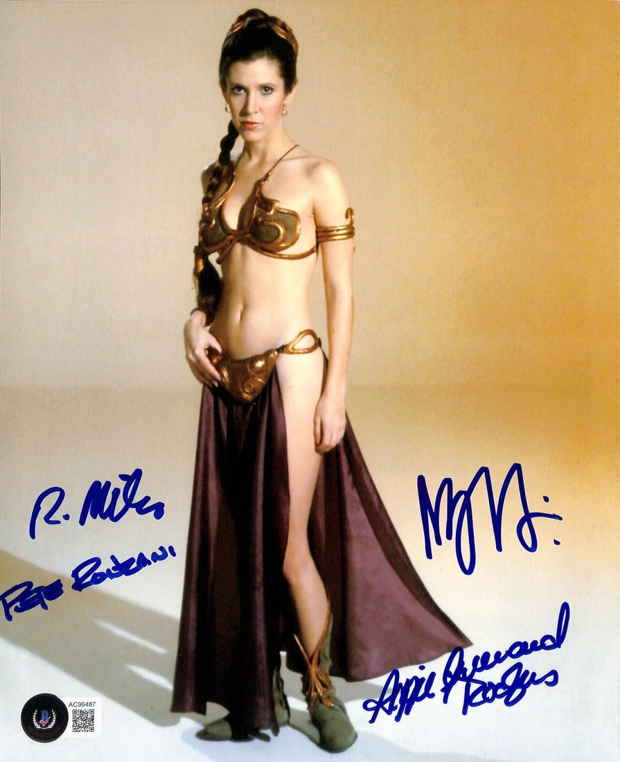 Star Wars ROTJ Slave Leia Signed 8x10 Photo by ILM Team Beckett Authenticated: Star Wars ROTJ Slave Leia Signed 8x10 Photo by ILM Team Beckett Authenticated This extraordinary 8x10 photograph features Carrie Fisher as Slave Leia from Star Wars: Return of the Jedi, signed by the