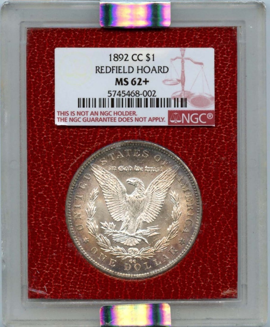 1892-CC NGC MS62+ Silver Morgan Dollar Redfield Hoard: 1892-CC NGC MS62+ Silver Morgan Dollar Redfield Hoard This 1892-CC Silver Morgan Dollar is a remarkable example, certified by NGC with a grade of MS62+. This uncirculated coin showcases the classic de
