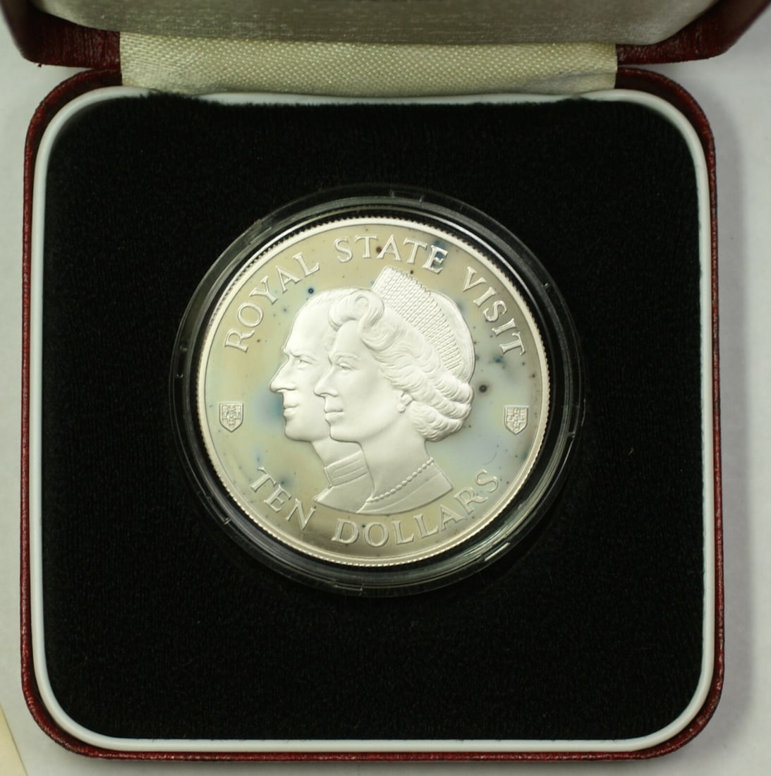 Jamaica 1983 Silver $10 Proof Coin Royal Visit in Original Packaging: Jamaica 1983 Silver $10 Proof Coin Royal Visit in Original Packaging This 1983 Jamaica Royal Visit Commemorative $10 proof coin was struck in 0.925 silver by the British Royal Mint and remains uncircu