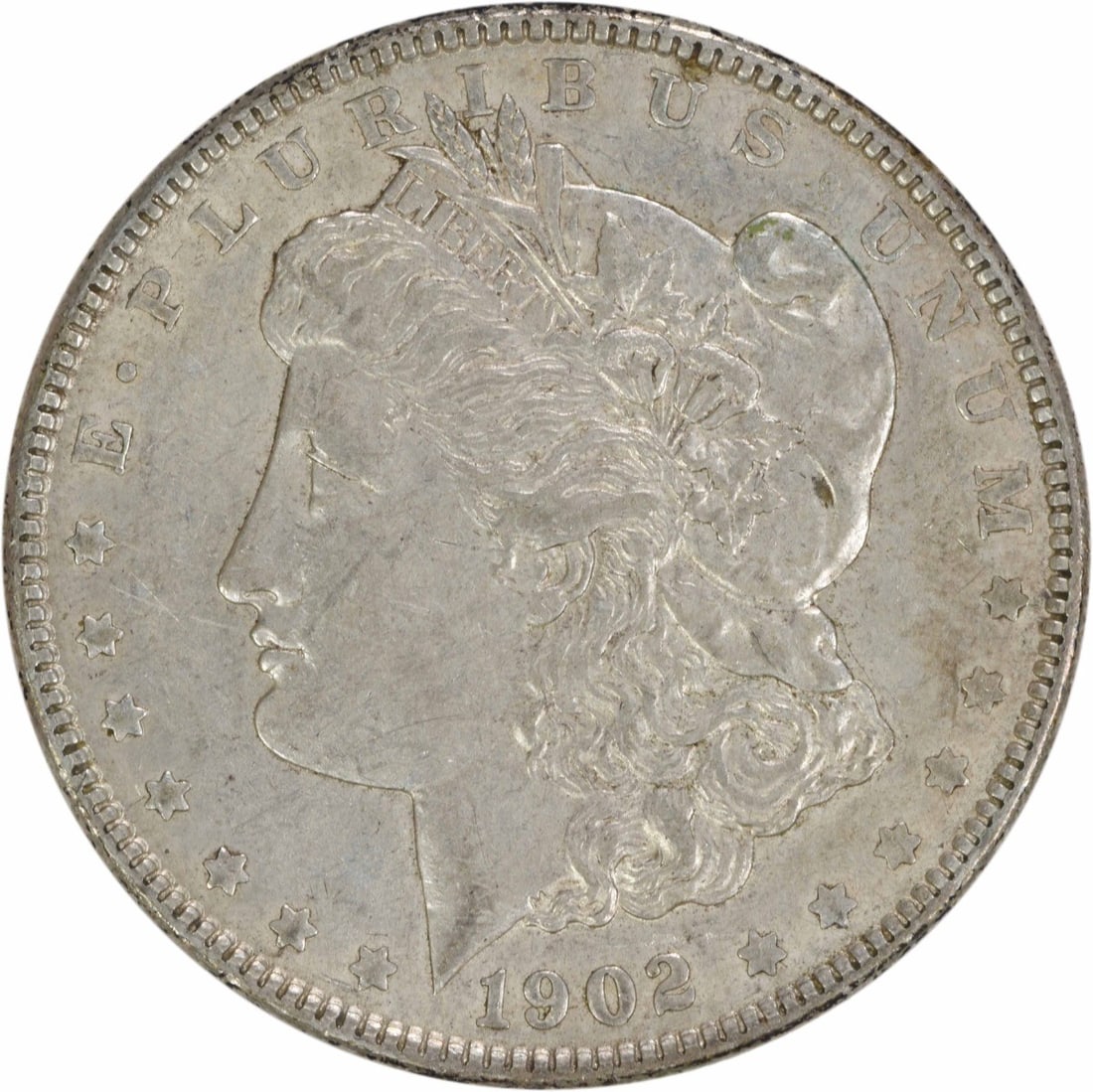 1902 Morgan Silver Dollar AU Uncertified 90% Silver Coin: 1902 Morgan Silver Dollar AU Uncertified 90% Silver Coin This 1902 Morgan Silver Dollar is a stunning example of American numismatic history. Featuring a grade of AU (About Uncirculated), this coin is
